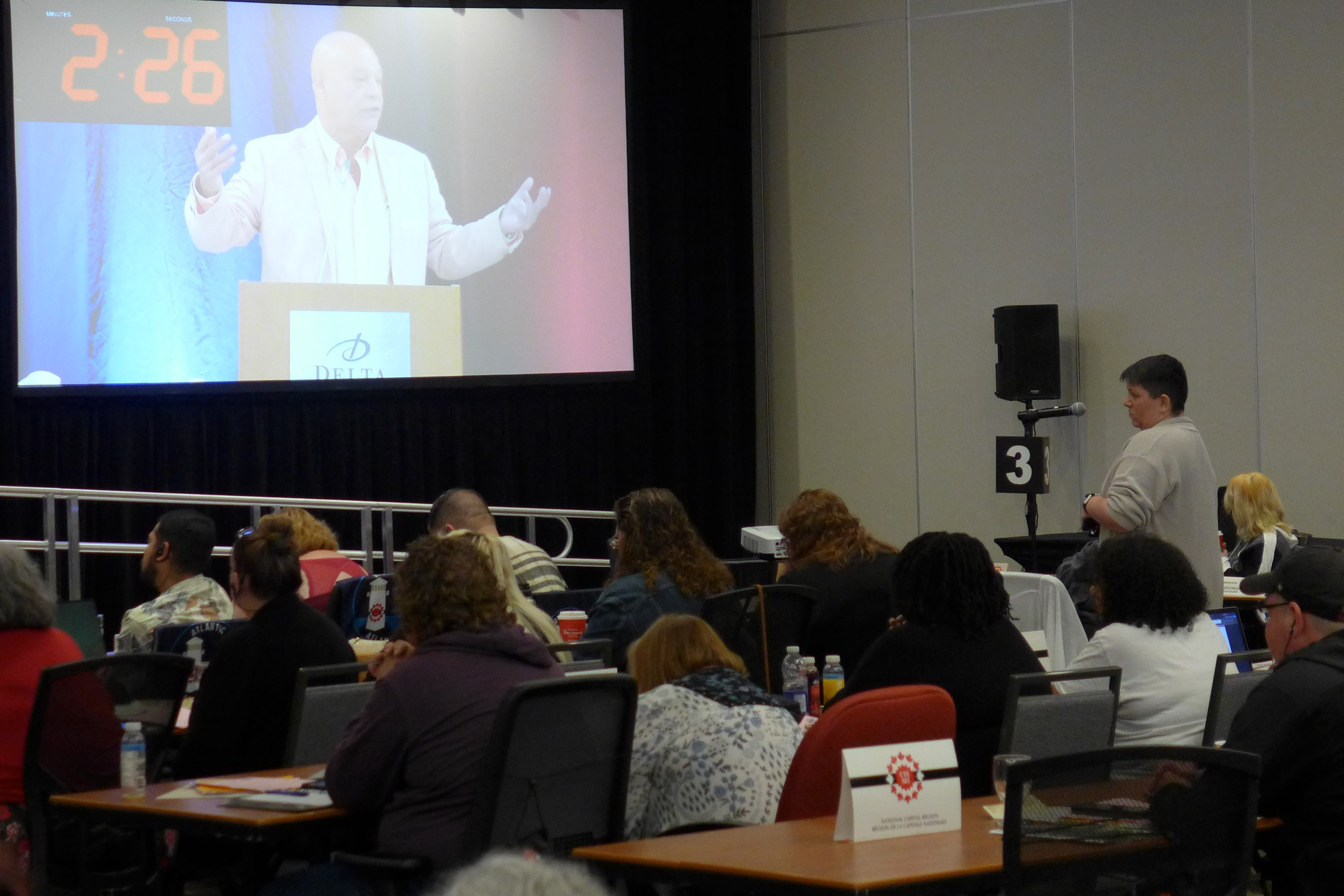 a delegate at the microphone