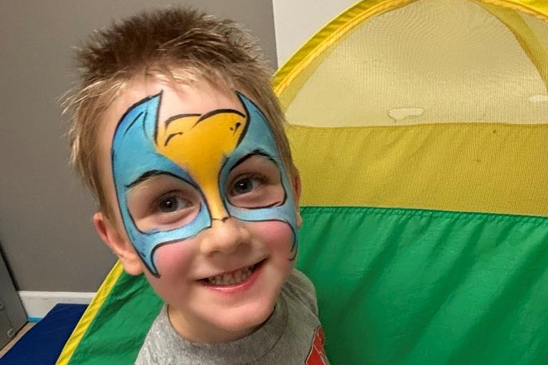 child with face painted