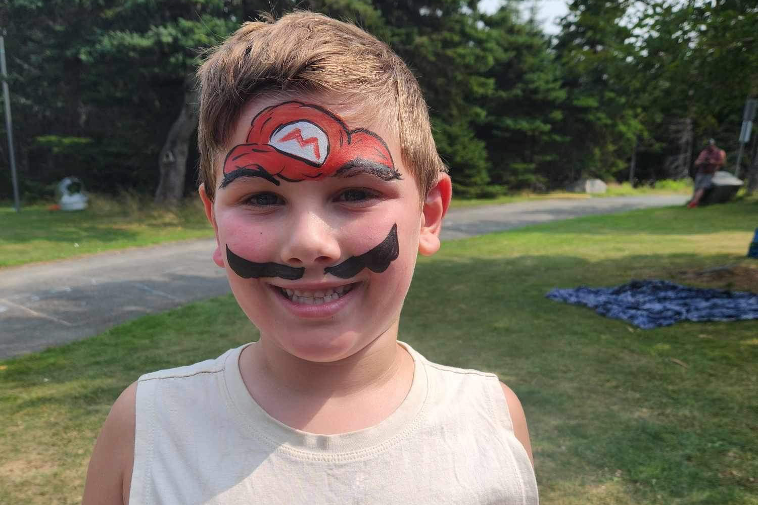 child with face painted