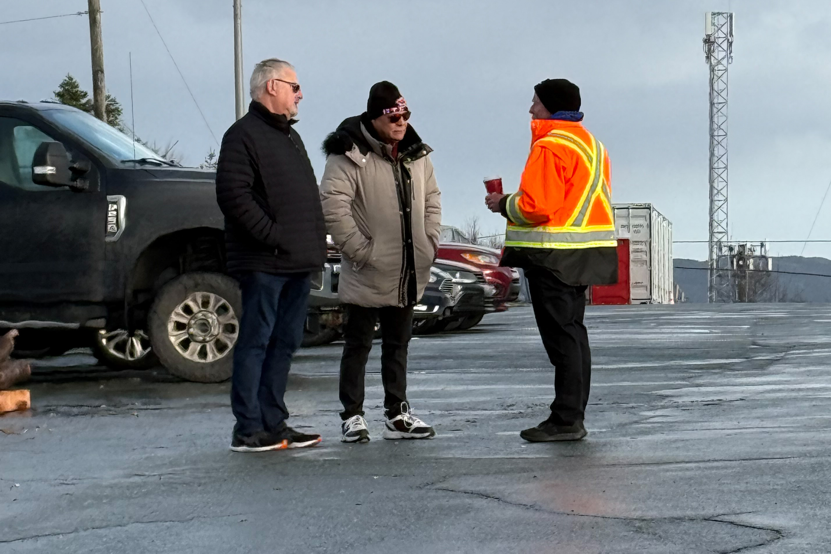 Brian Oldford and Doug Gaetz speaking with a striker