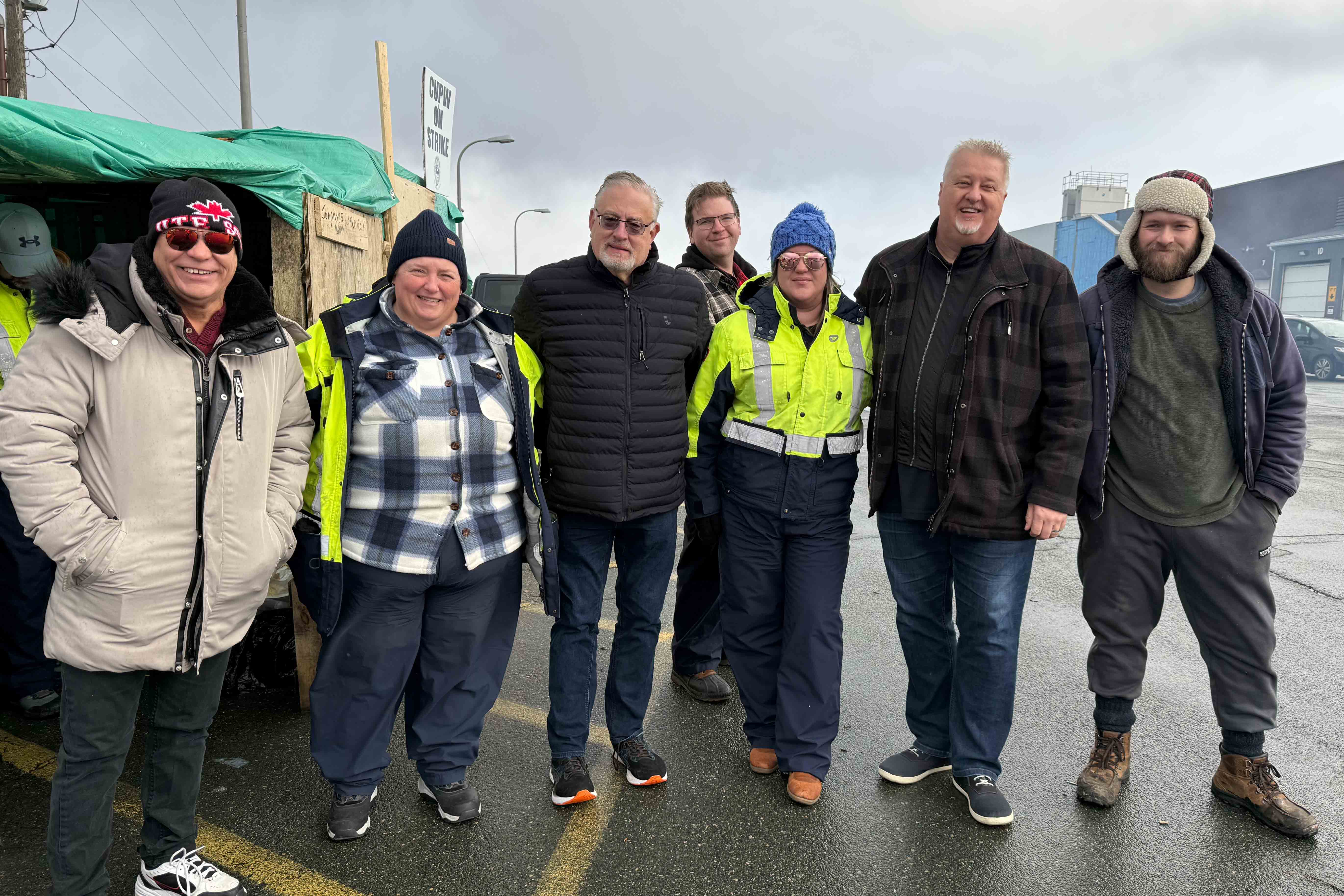 Marc Brière, Doug Gaetz and Brian Oldford with CUPW members