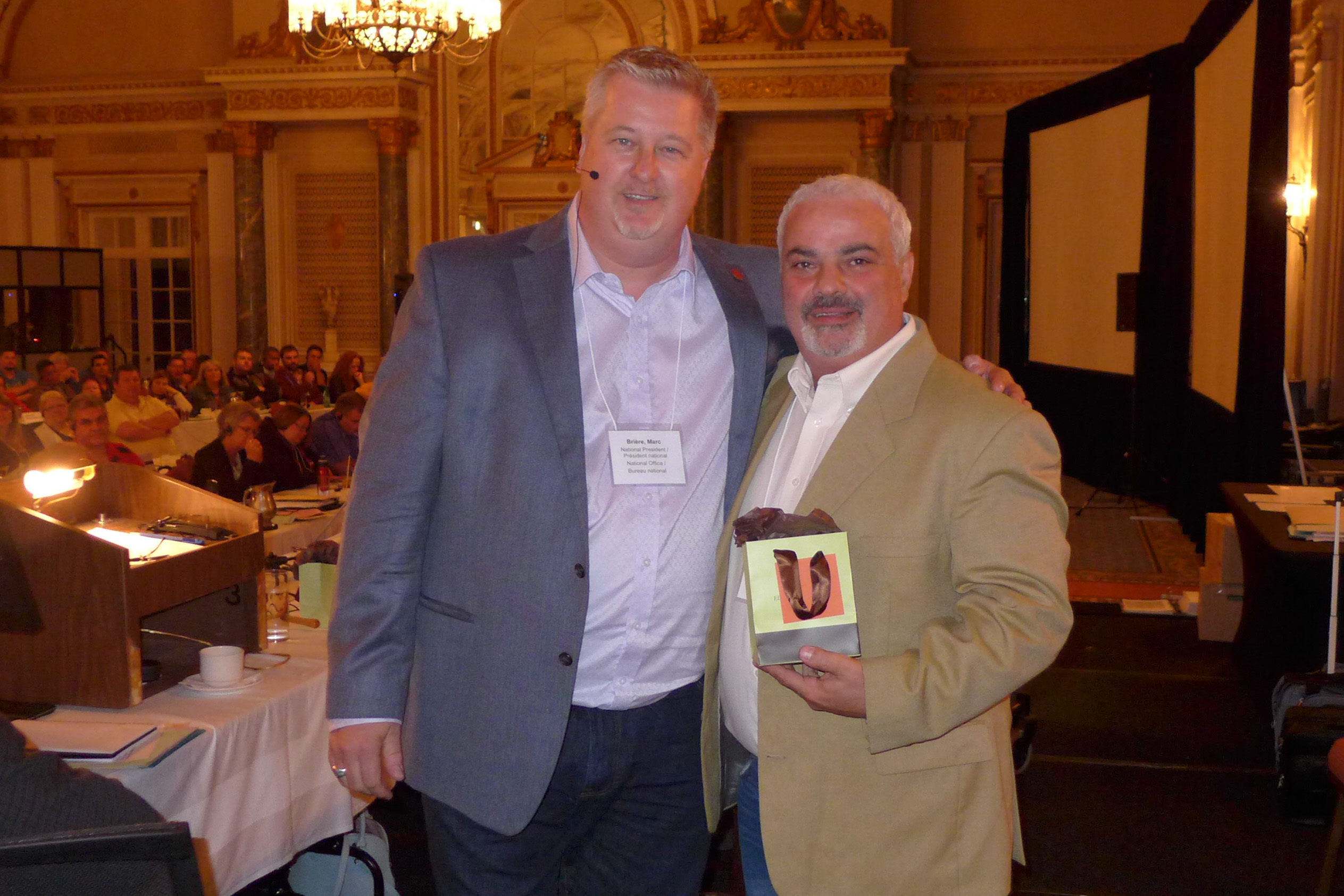 Marc Brière, National President awards a 25-year pin to Cosimo Crupi 