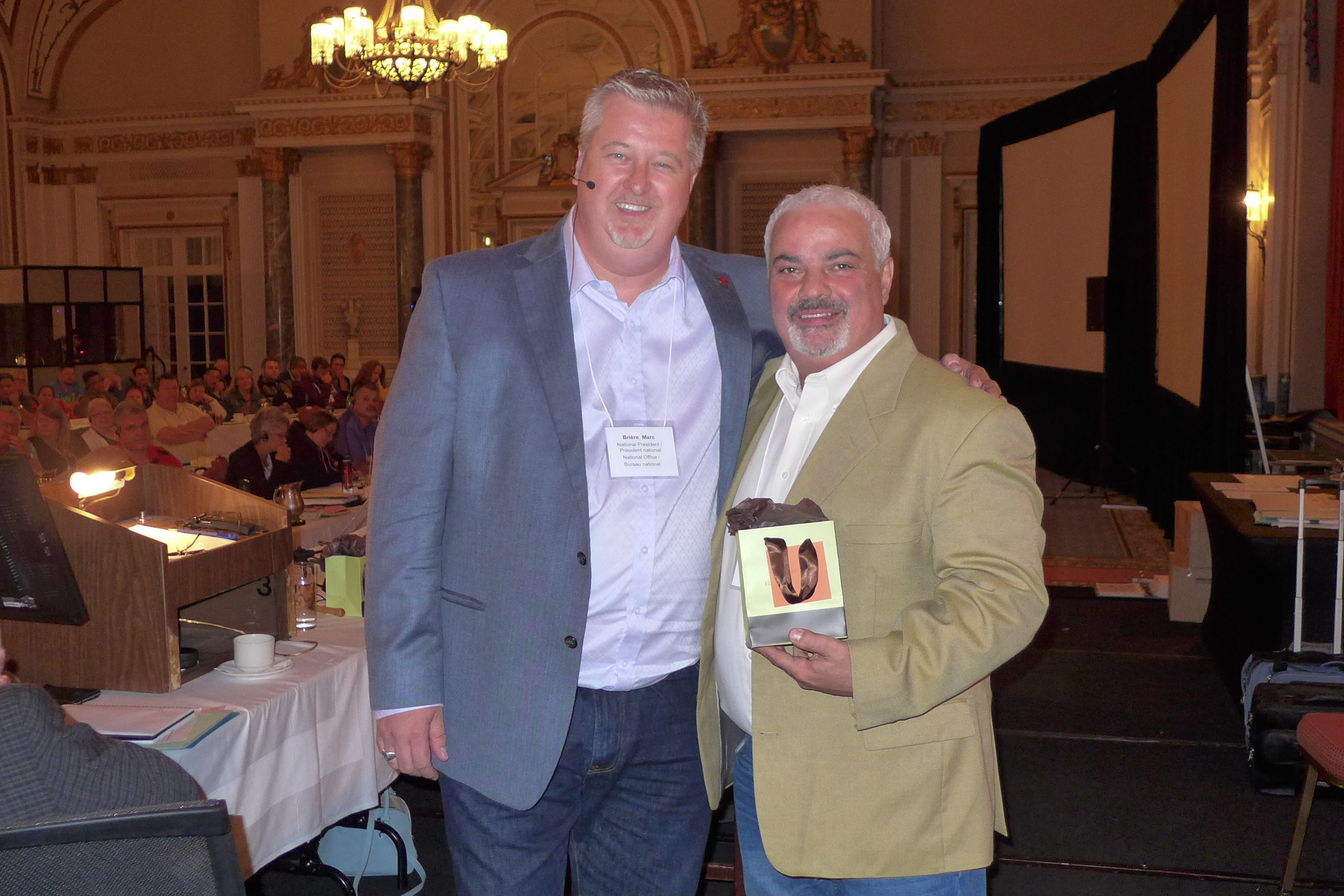 Marc Brière, National President awards a 25-year pin to Cosimo Crupi 