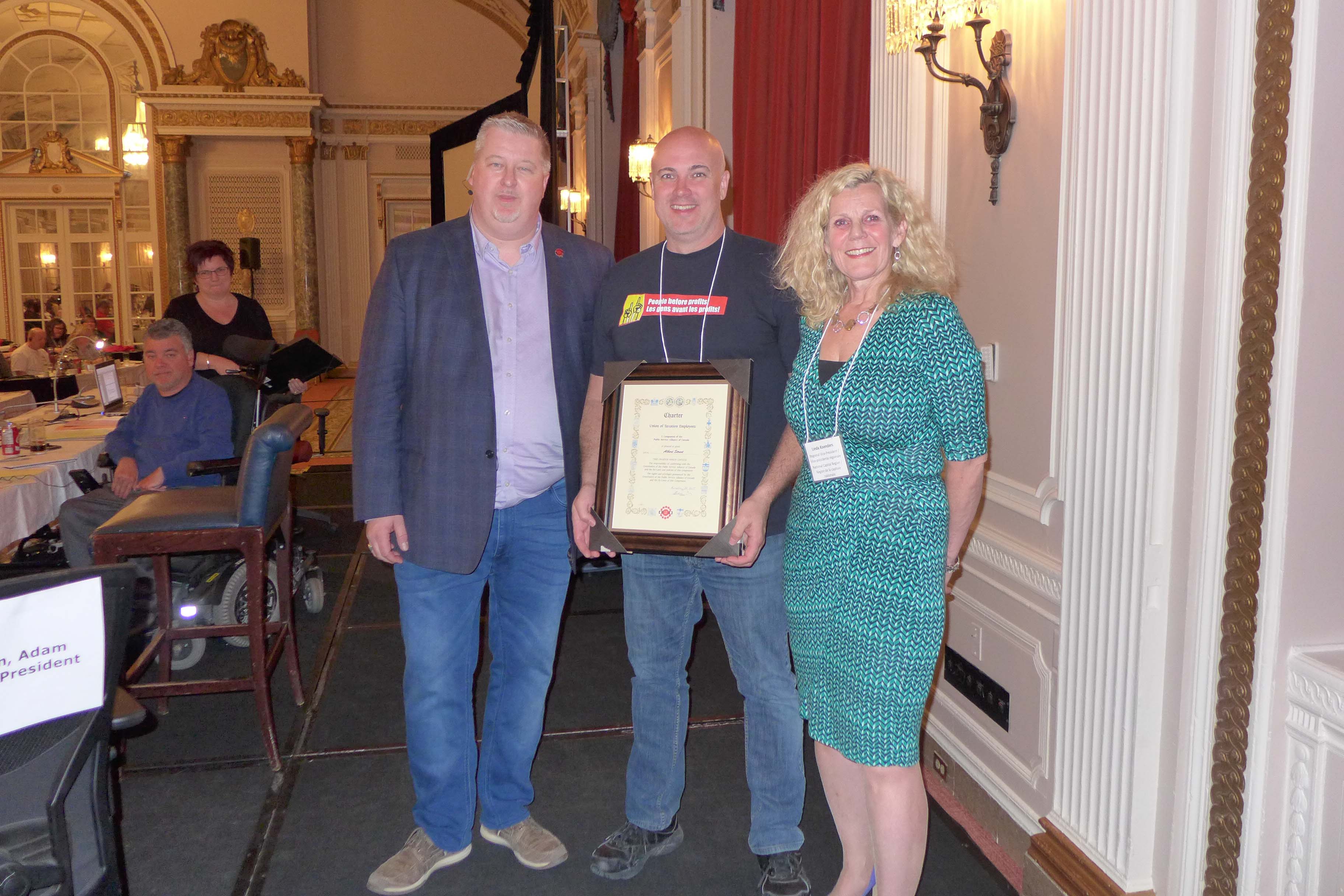 National President, Marc Brière and Linda Koenders, RVP for the NCR present Scott Henneberry, President of Local 70022 - Albert Street, with the Local's Charter
