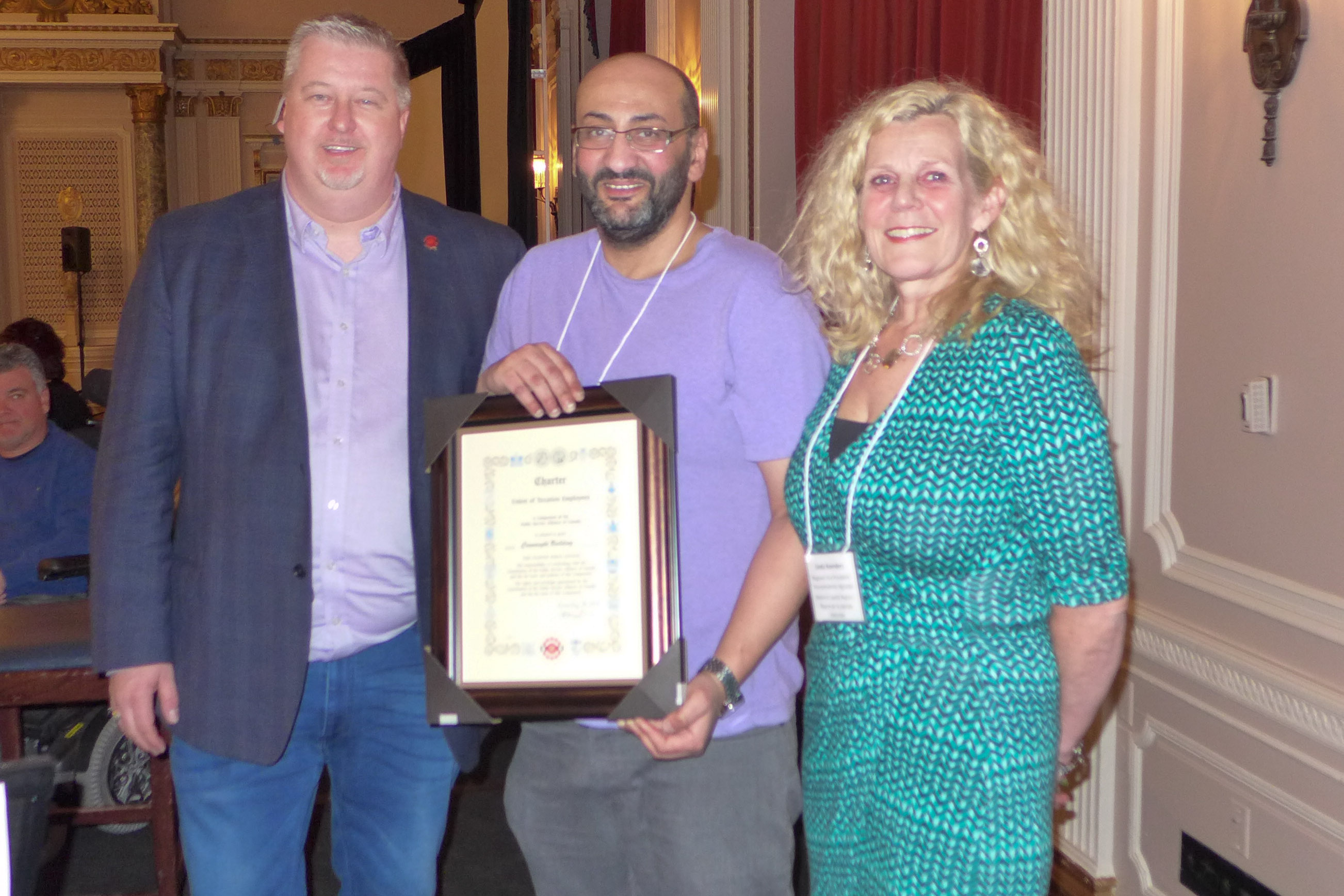 National President, Marc Brière and Linda Koenders, RVP for the NCR present Shady Zekry, President of Local 70021 - Connaught Building with the local's Charter