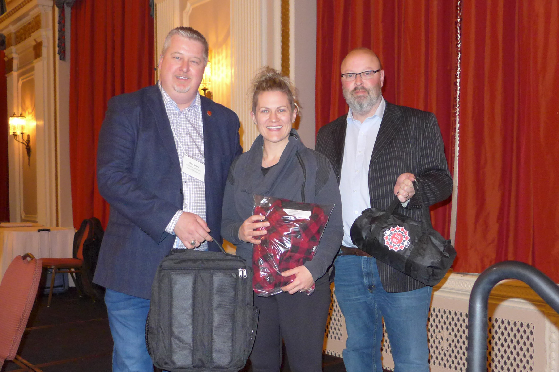 Marc Brière and Adam Jackson with the winner of the bargaining slogan contest