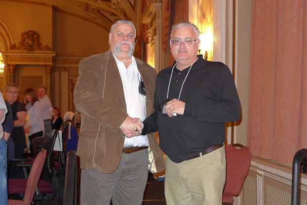 Brian Oldford received his 25 year service pin from Robert Campbell.