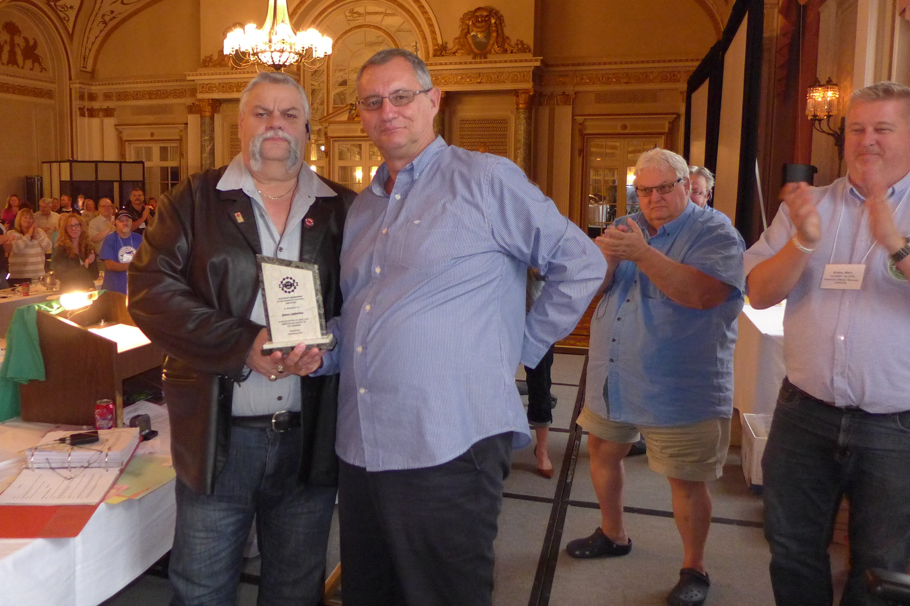 Robert Campbell and James Infantino. James Infantino is awarded Honorary Membership in UTE