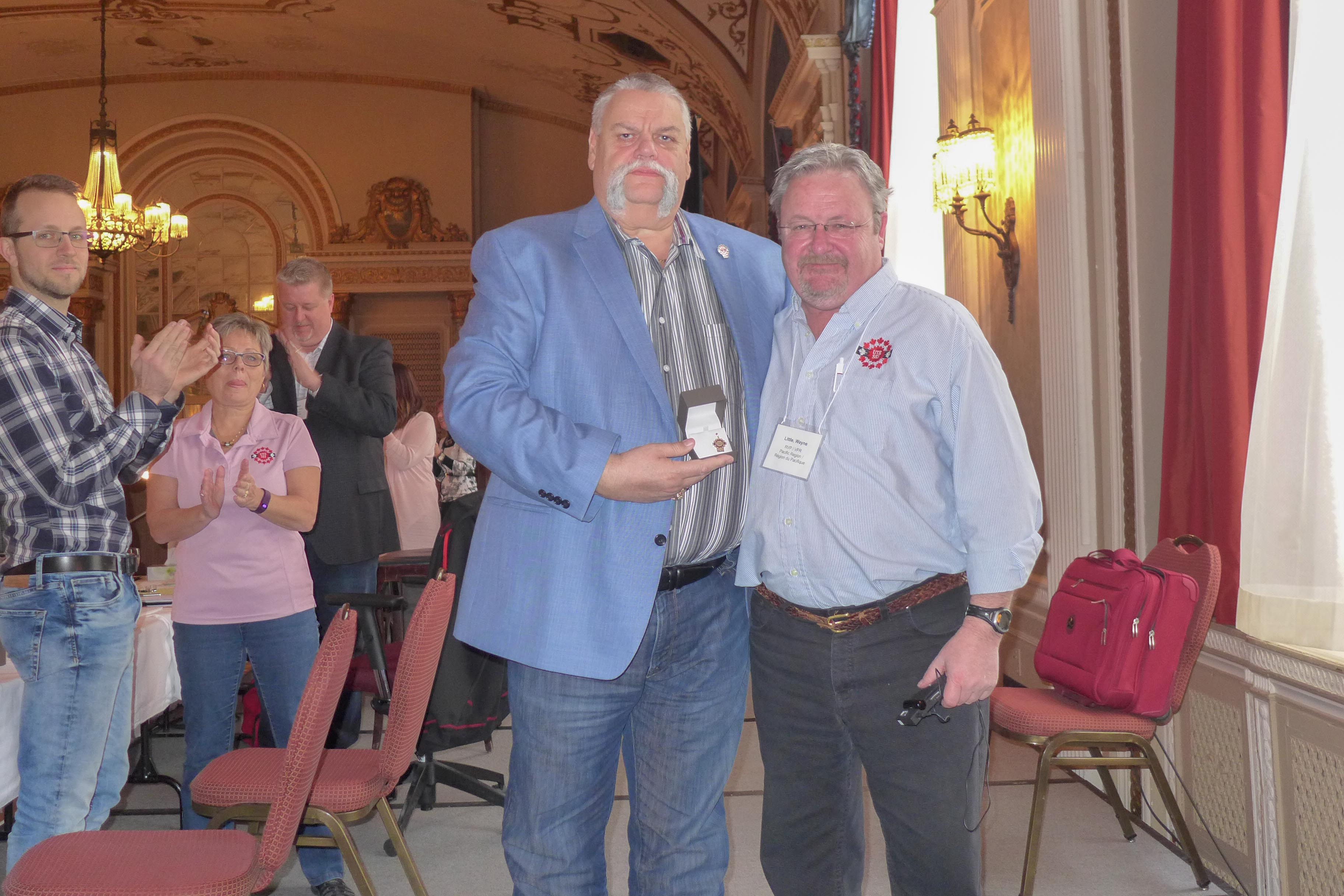 Robert Campbell receives his 40 year pin from Wayne Little 