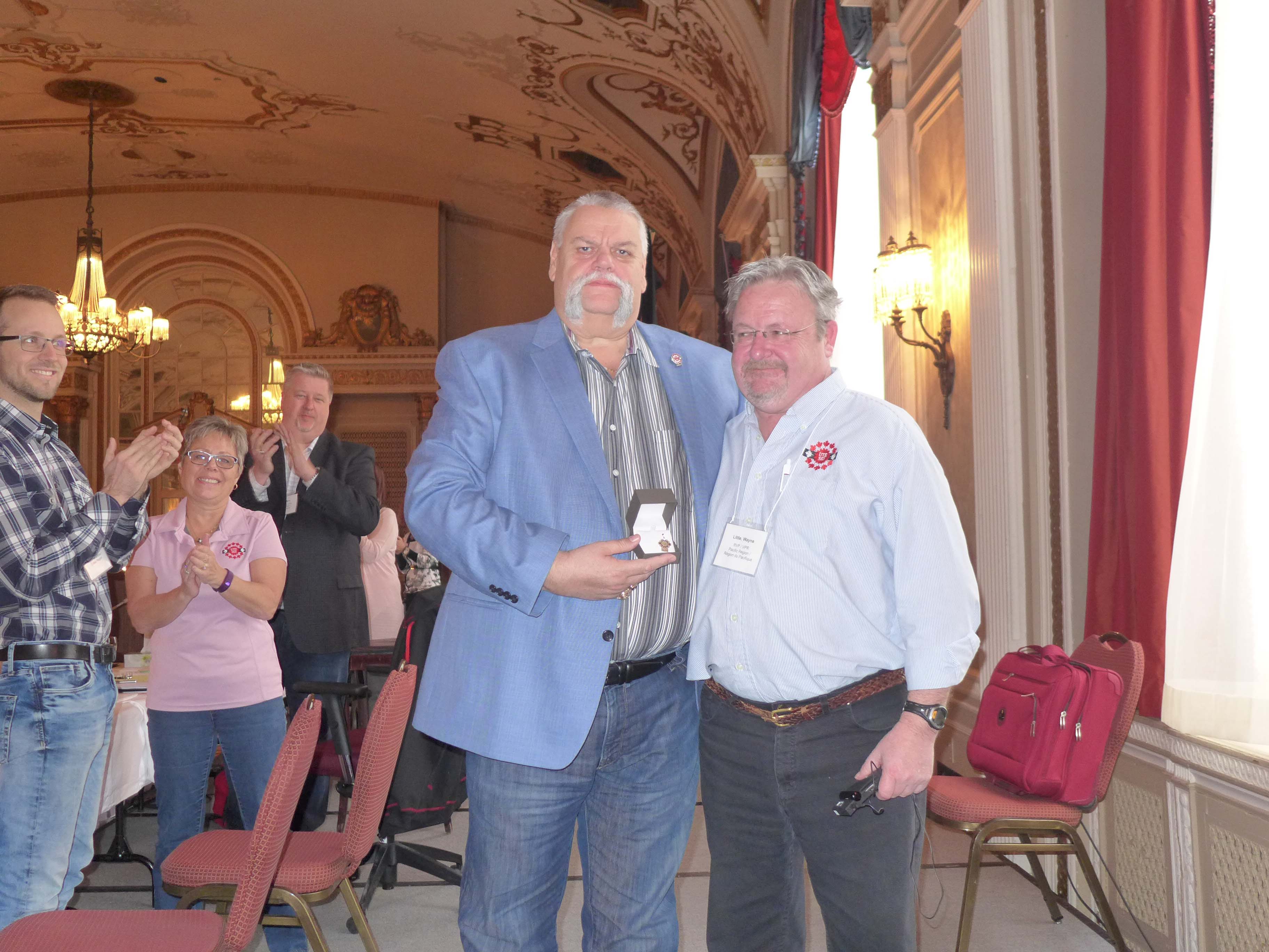 Robert Campbell receives his 40 year pin from Wayne Little 