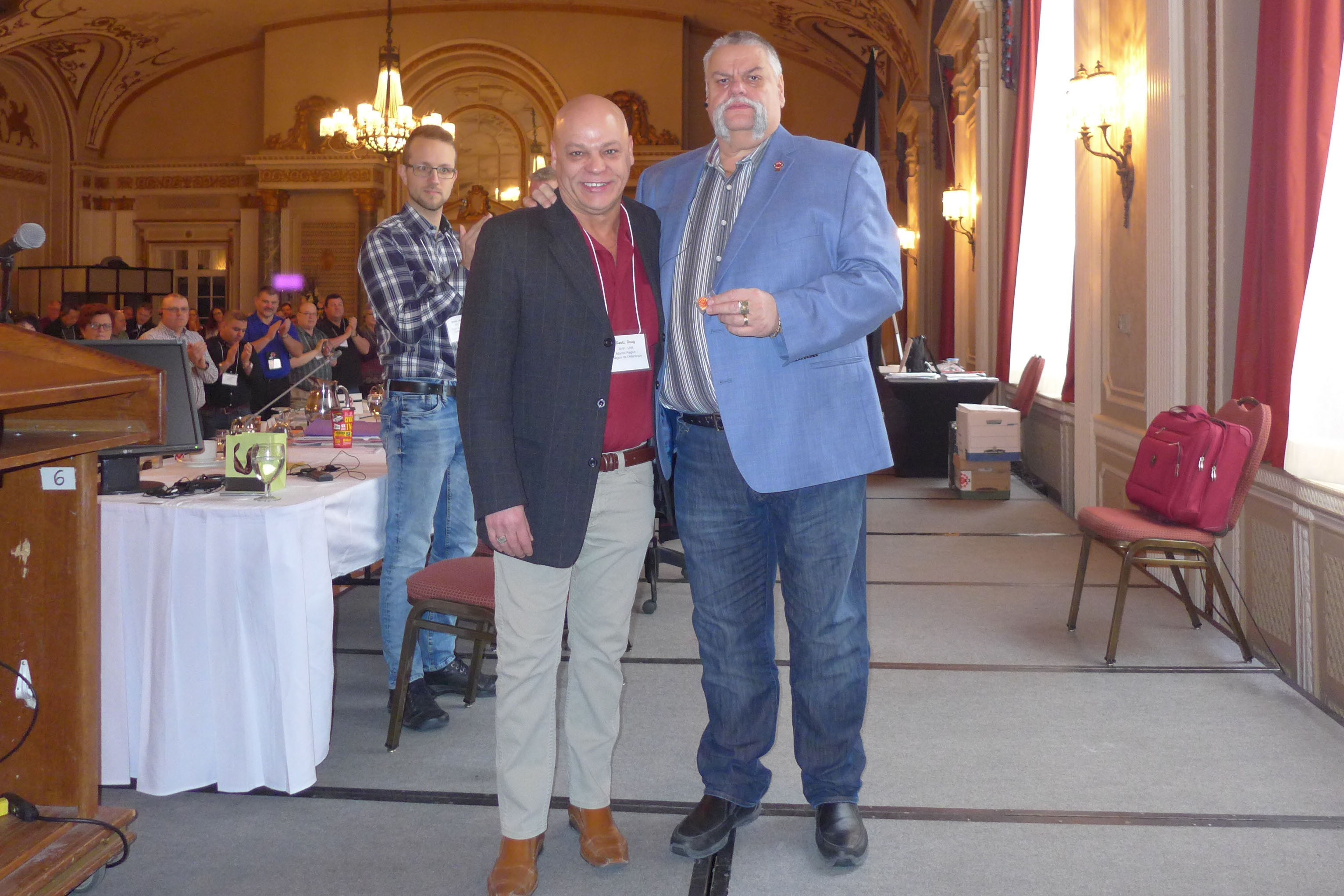 Doug Gaetz receives his 30 year pin from Robert Campbell