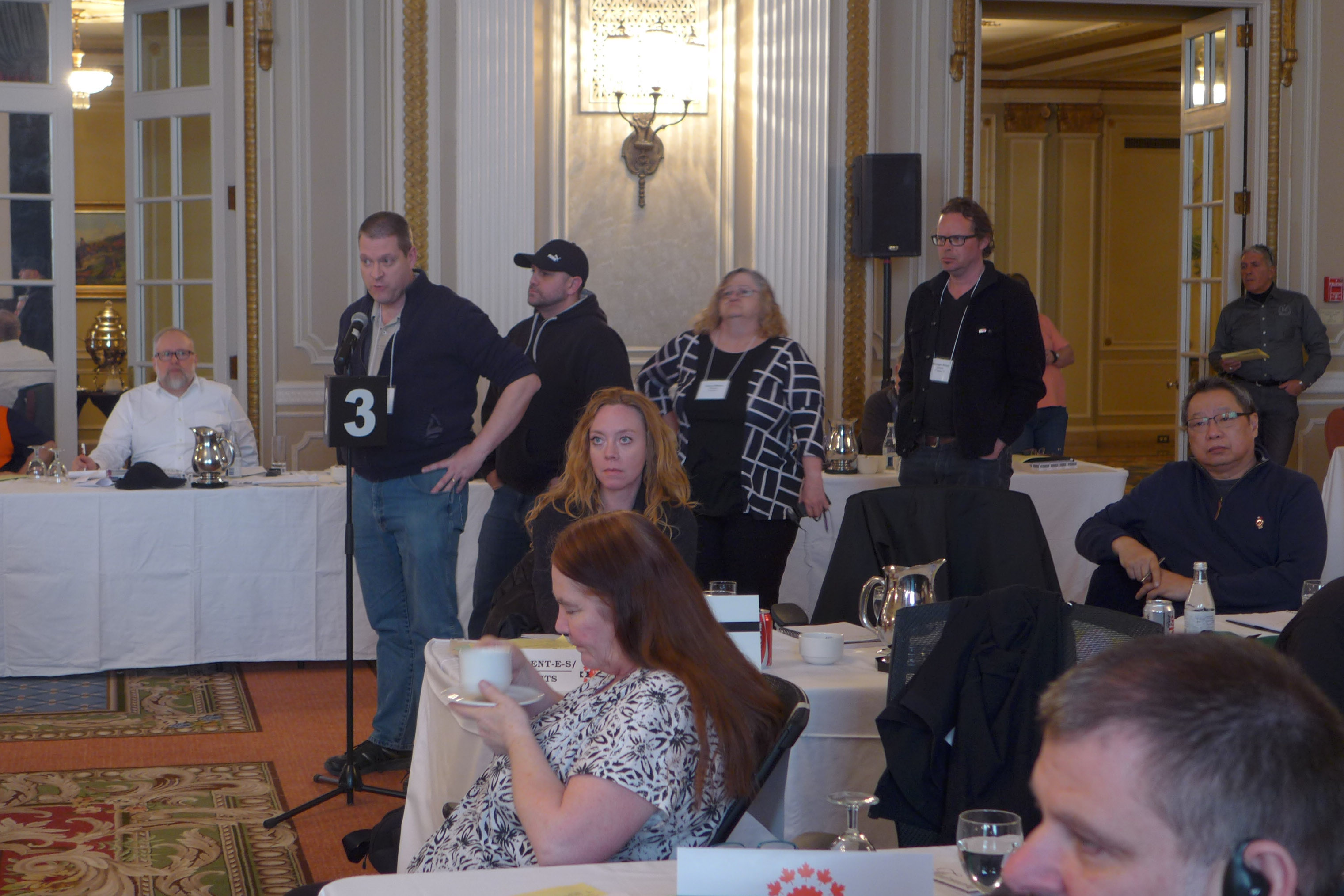 Presidents lined up to speak at a microphone