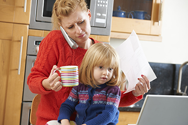 photo of woman juggling family and work