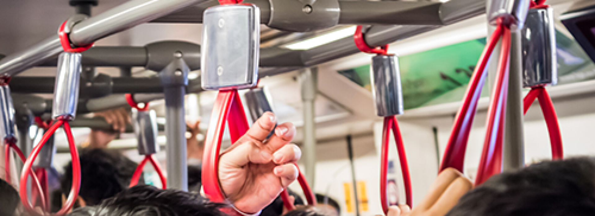 crowded bus, standing room only